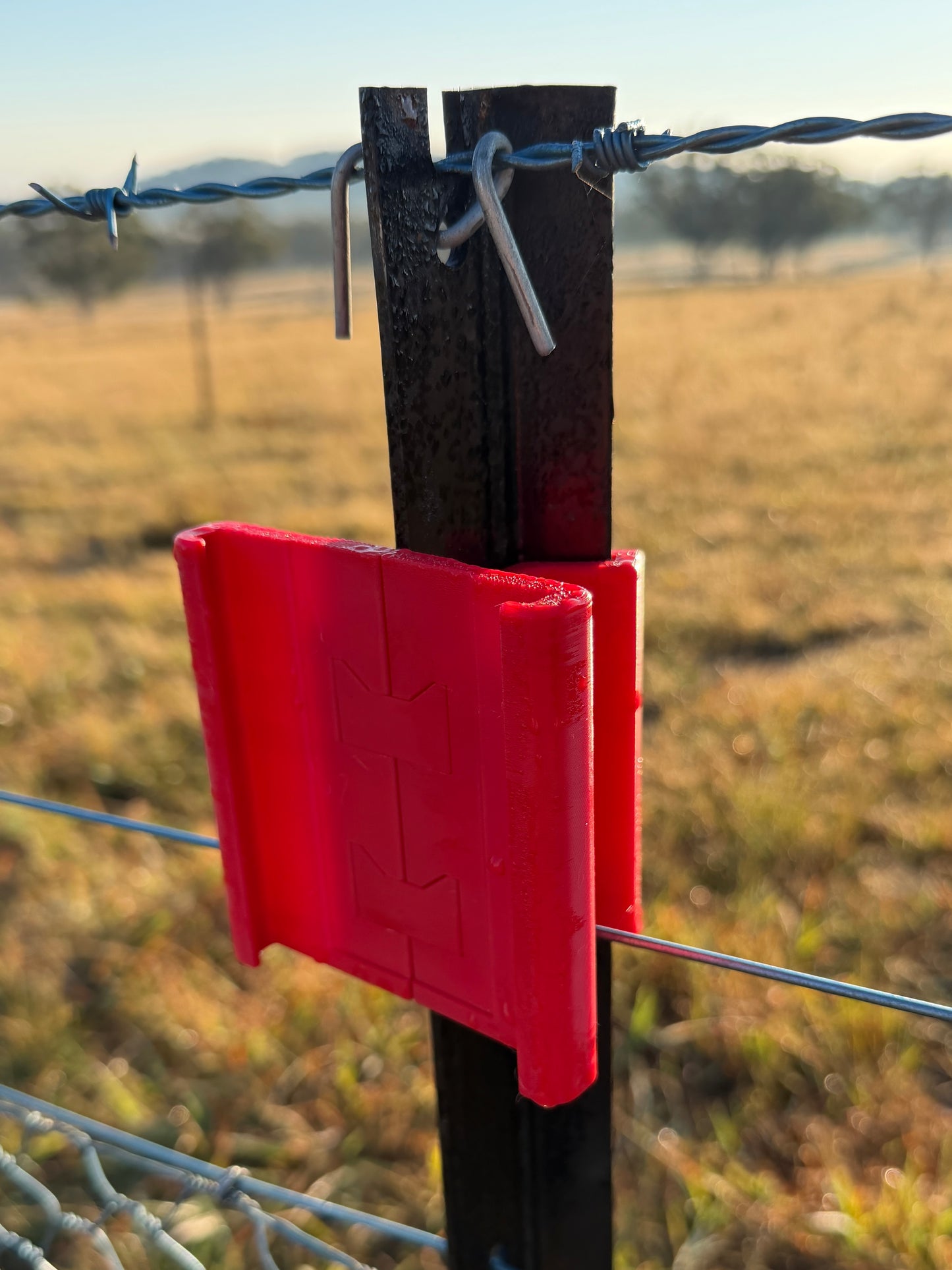 Rain Gauge mounted on farm fence post – bracket