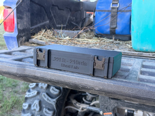22LR ammunition storage box holding 210 rounds with upright cartridge slots and secure latch