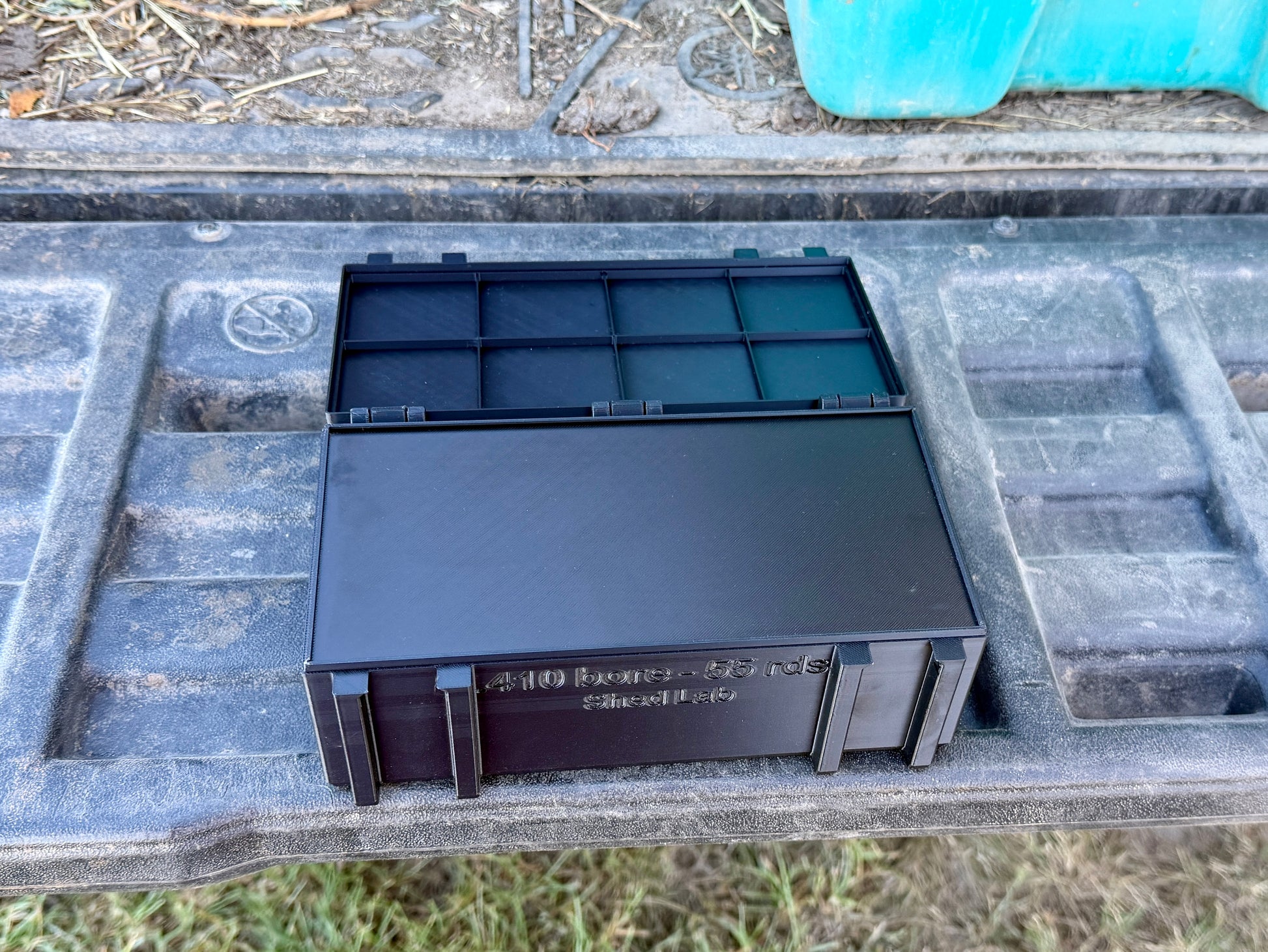 Inside view of 410 ammunition box showing sliding internal lid