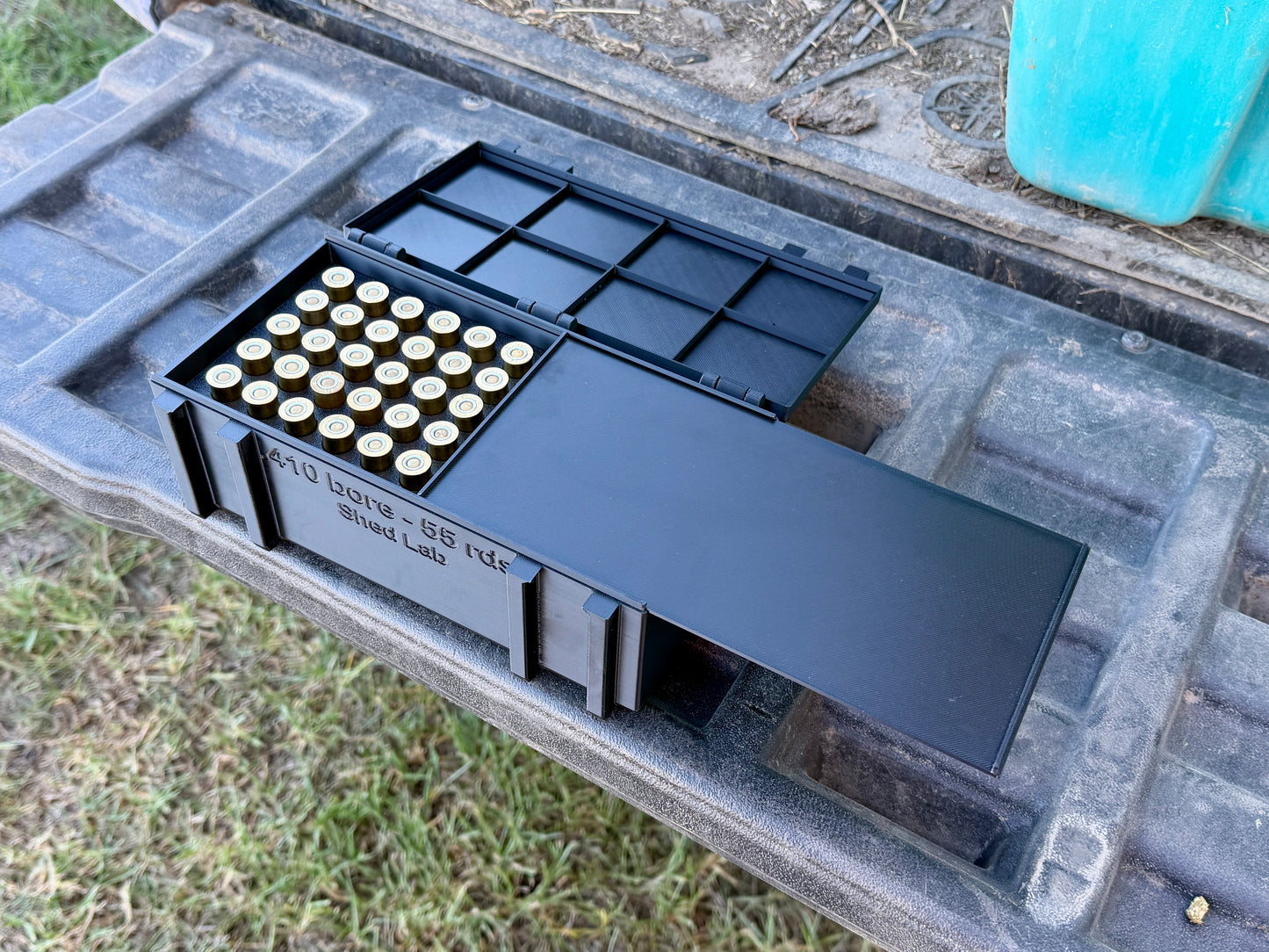 Inside view of 410 ammunition box showing upright shell storage slots