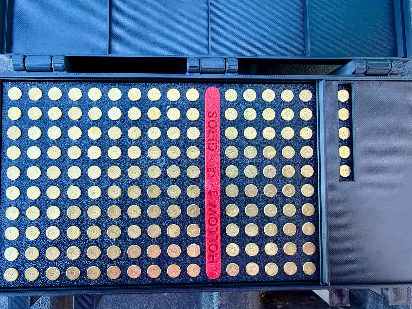 Close-up of upright cartridge slots inside the 22LR ammunition organiser